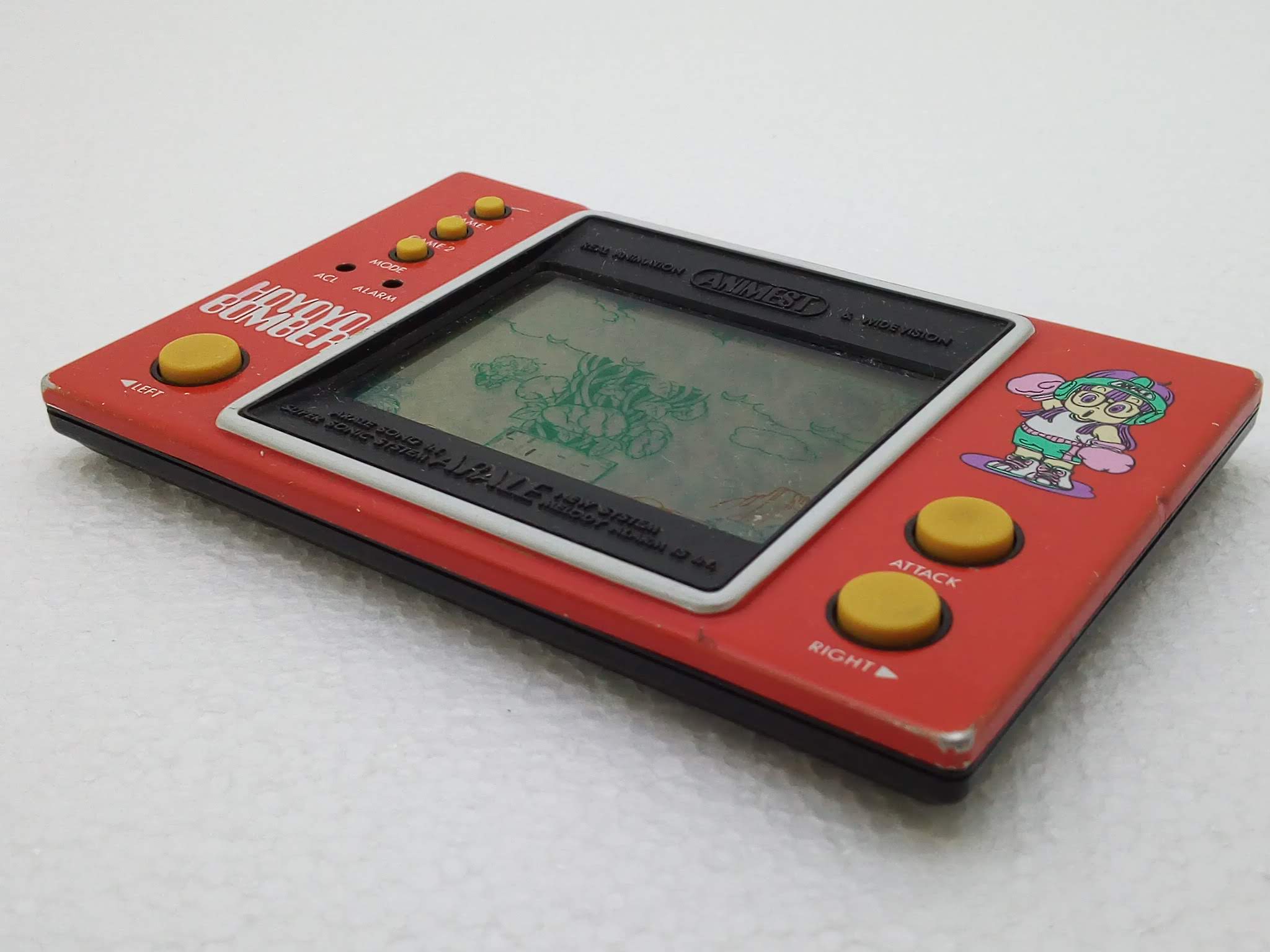 Handheld Empire - game | Popy Electronics : Dr. Slump Arale Part I Hoyoyo  Bomber - red